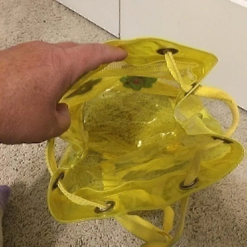 Girl’s yellow beach bag